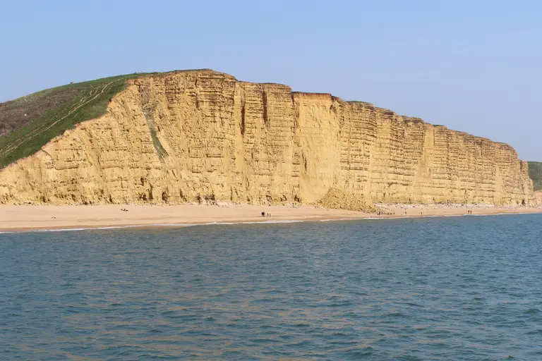East Cliff at West Bay: the tall golden sandstone cliff beside the beach